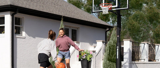 Marin Backyards | Shop Basketball Hoops, Courts and Accessories | 2 girls playing basketball in their backyard