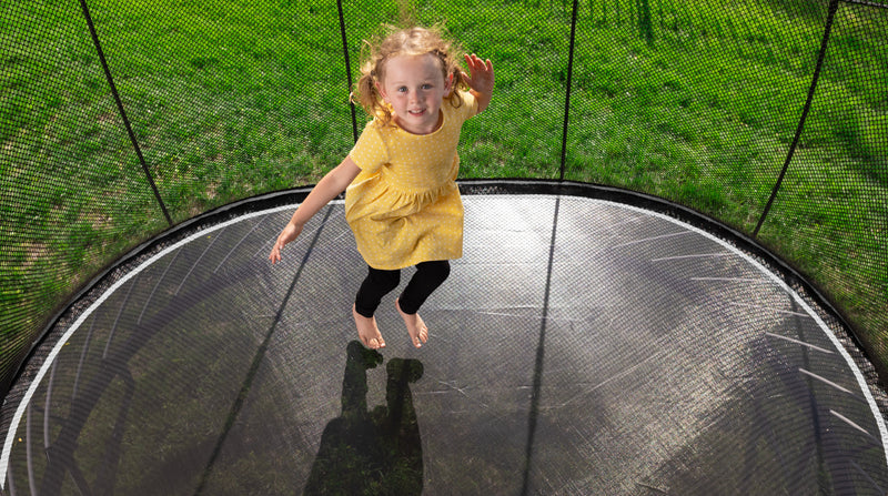 Load image into Gallery viewer, Springfree trampoline compact oval with girl
