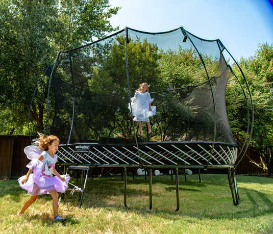 springfree trampoline with two girls playing